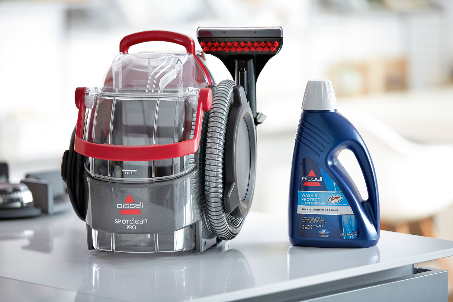 https://www.luxuriousmagazine.com/wp-content/uploads/2020/10/The-BISSELL-SpotClean-Pro-machine-with-a-bottle-of-detergent.jpg