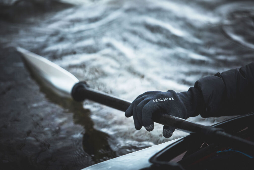 Canoeist wearing the Waterproof All Weather Multi-Activity Gloves