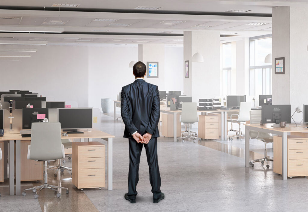 A travel boss standing in an empty office