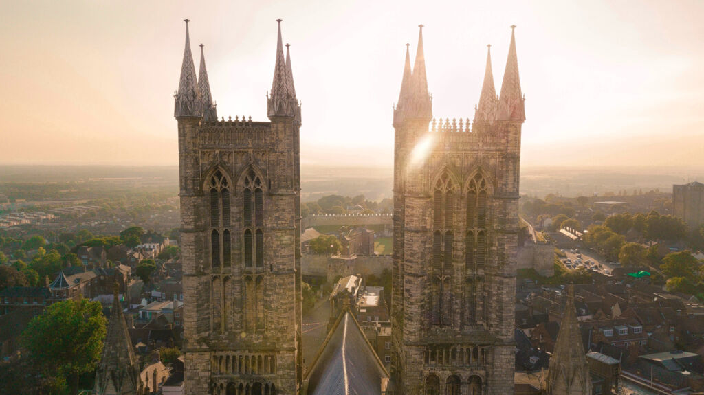 The twin spires of Lincoln Cathedral at sunset