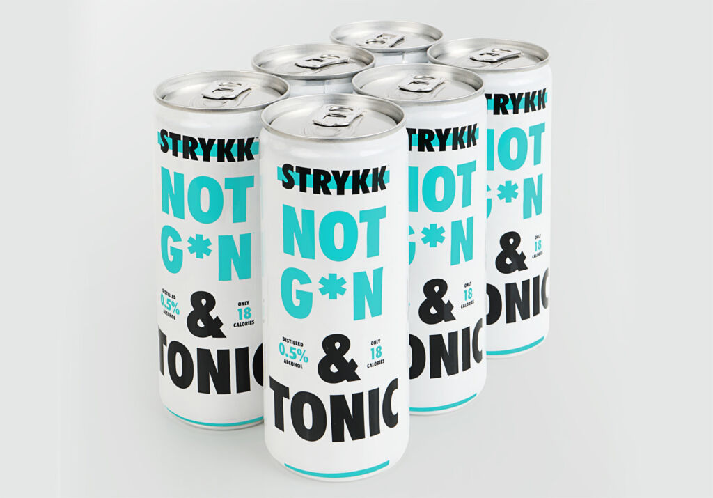 Six STRYKK NOT GIN and Tonic cans on a table