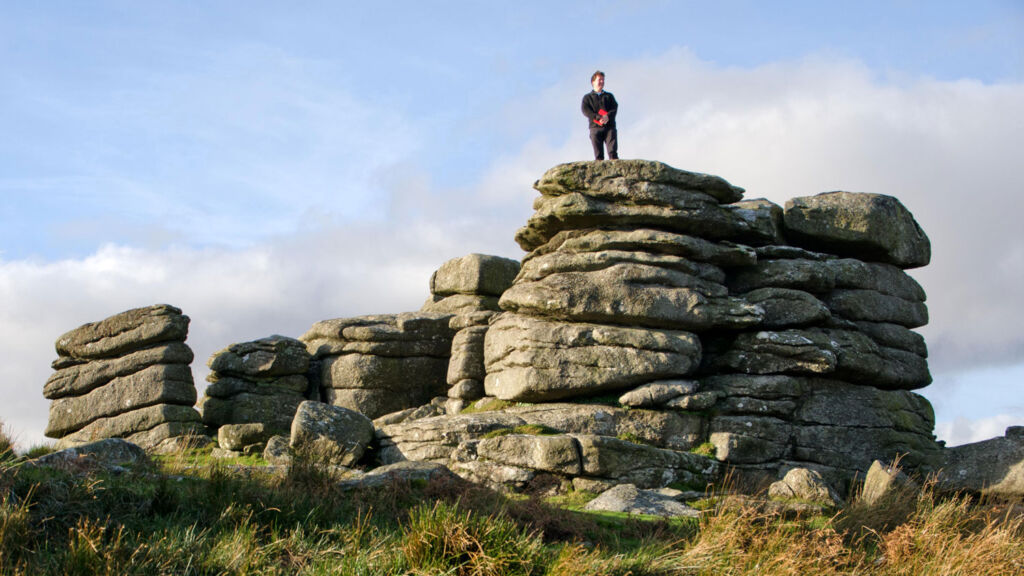 Alex standing on some ancient rocks