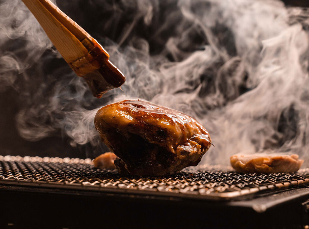 Meat using traditional African cooking over a fire