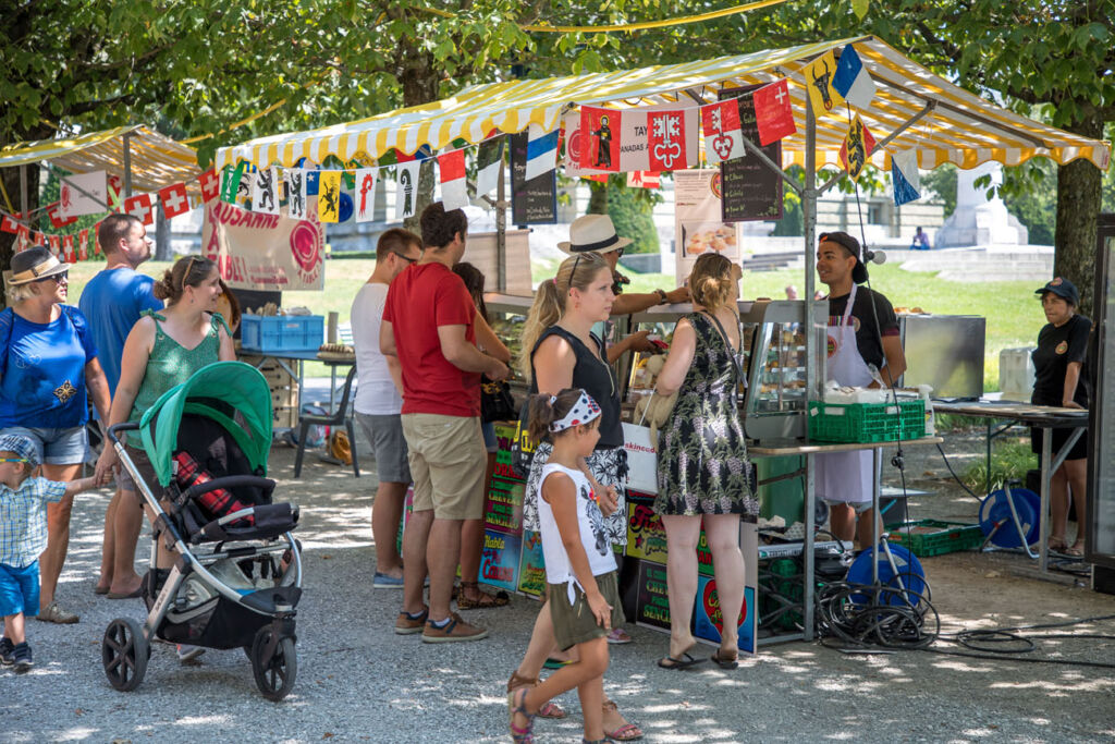 People wandering around the stall trying to decide which of the lovely foods to try