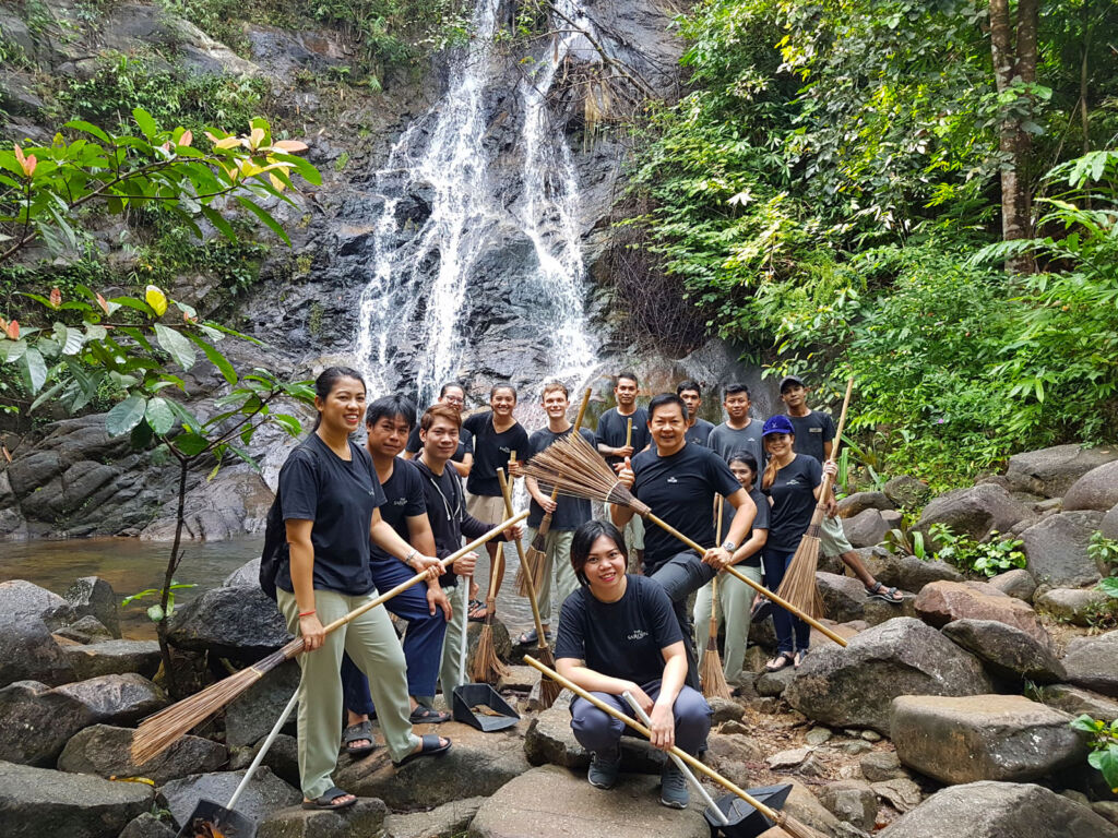 Waterfall cleaning with the resort's staff