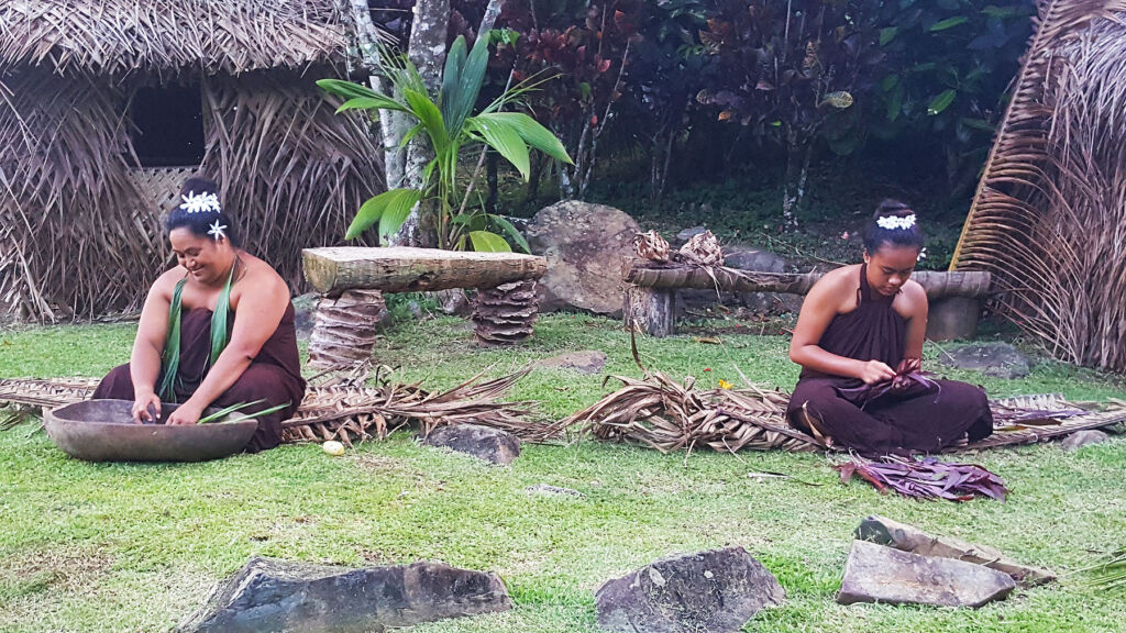 Two local women weaving baskets