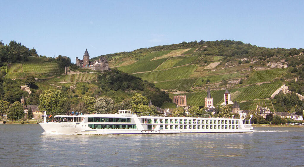 The Emerald Dawn sailing serenely along the river