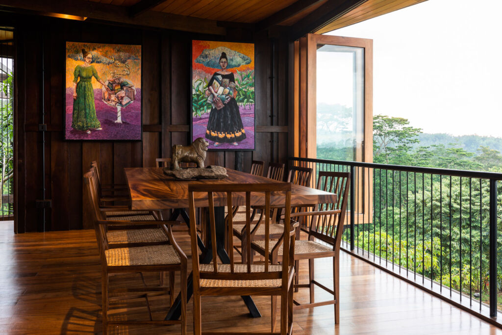 The dining room with locally made artwork on the wall and incredible views over the jungle