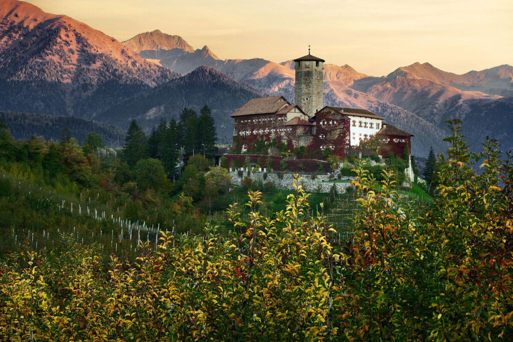 The exterior of Castel Valer at sunrise