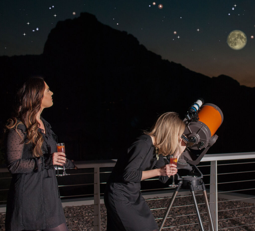 Young woman stargazing with a refractor telescope