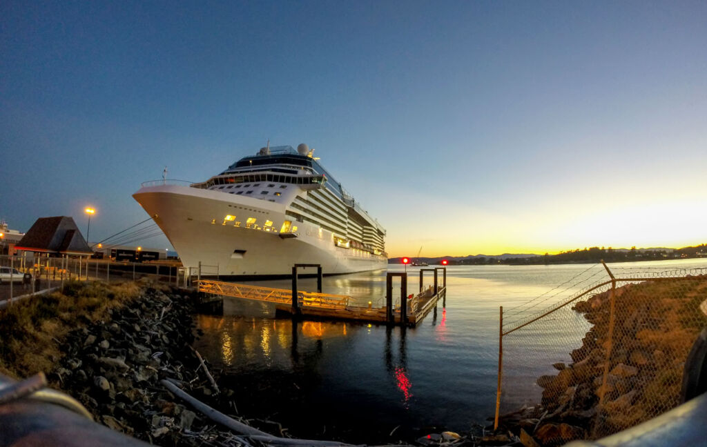 A cruise ship moored at sunset