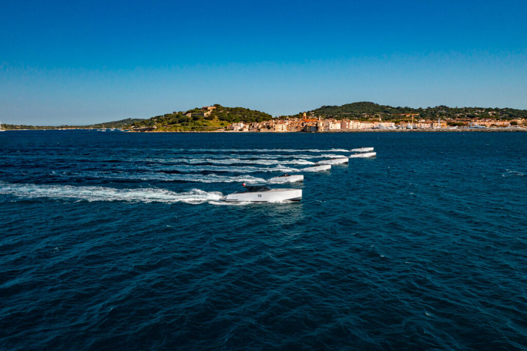 The tenders travelling across the water