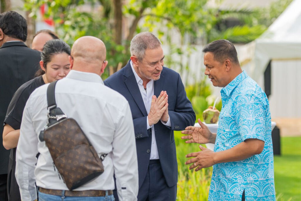 Company officials greeting guests and dignitaries