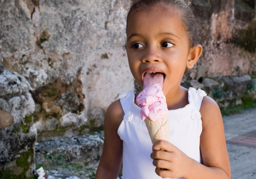 A young girl enjoying an ice cream