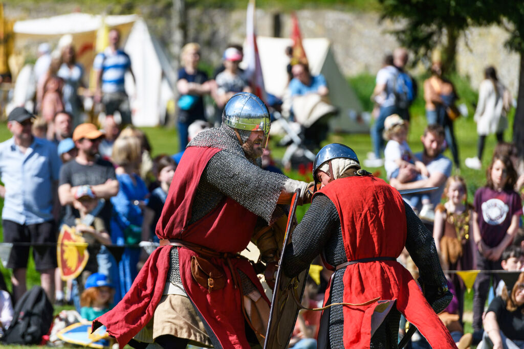 Knight in combat entertaining the watching crowd