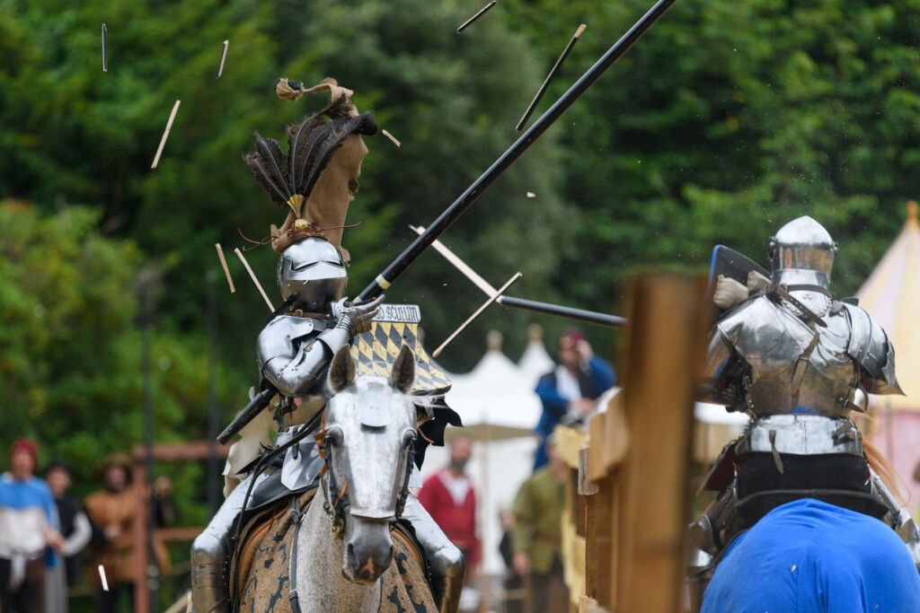 Knights jousting on horseback in the grounds