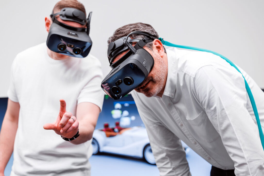 Designers using virtual reality headsets during the design process