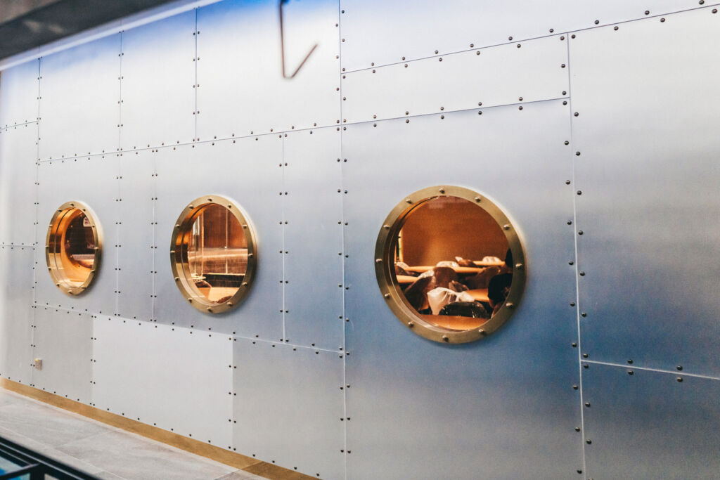 The brass porthole mirrors in the restaurant