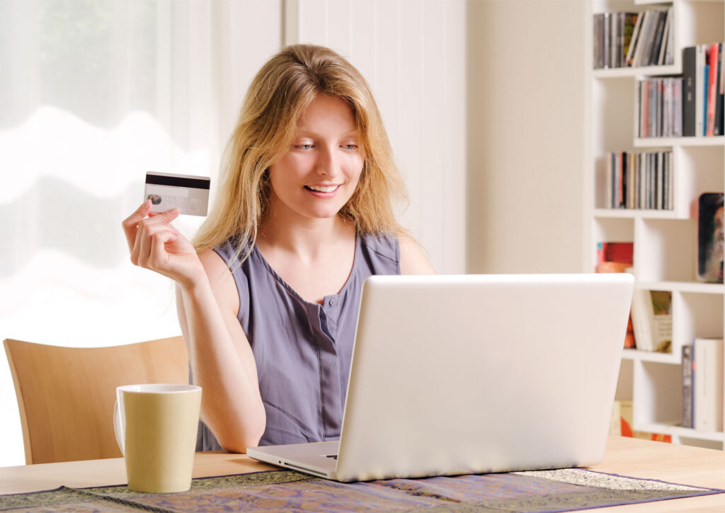 A woman shopping online from her notebook