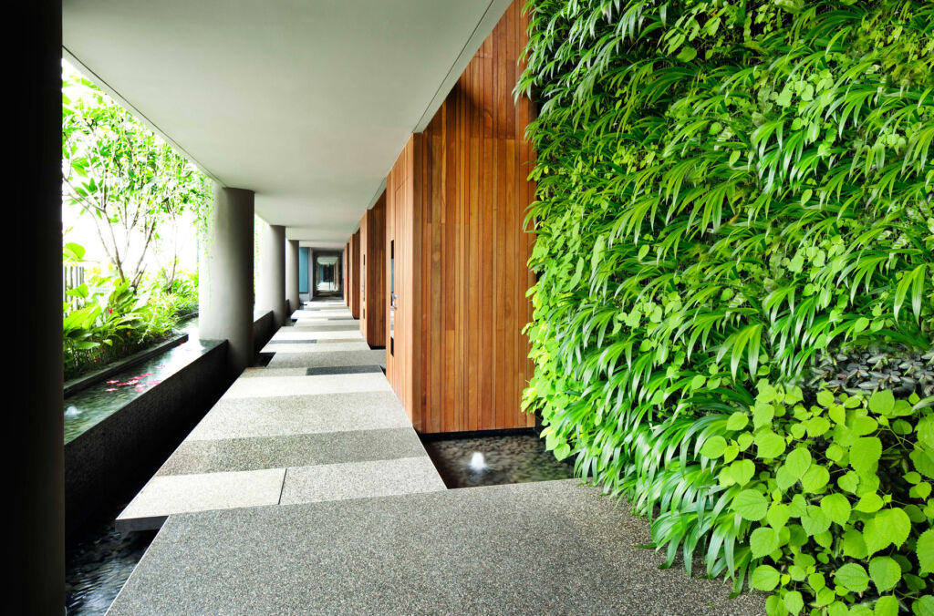 The greenery on the corridor walls helps to naturally ventilate the hotel