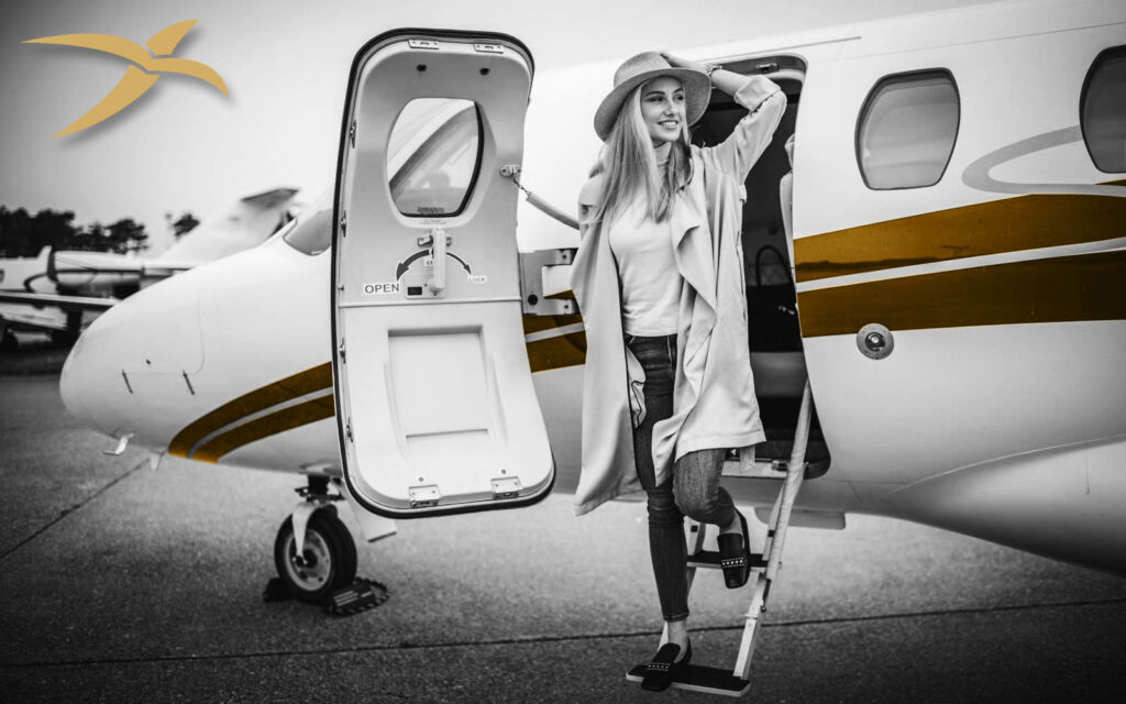 A woman disembarking from a private jet