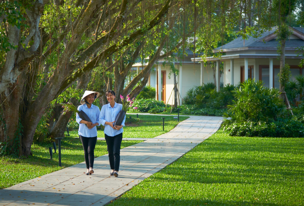 Staff sharing a laugh while walking through the resorts grounds