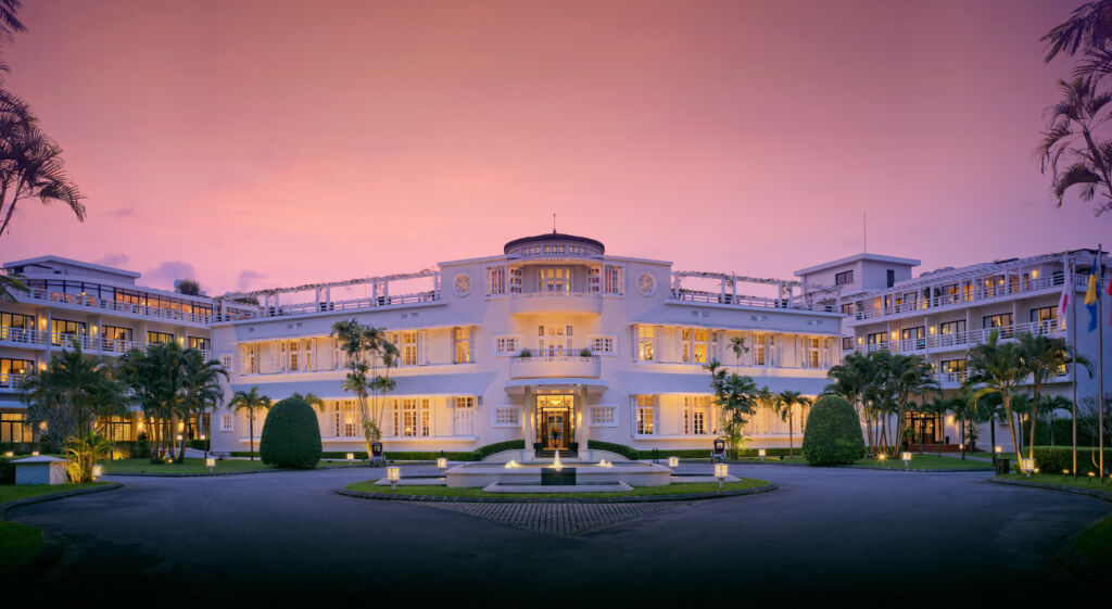 The exterior of the main building at the resort at sunset