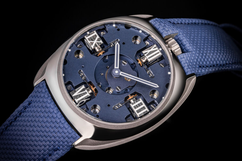 A close up view of a blue GYRO dial with roman numeral indices