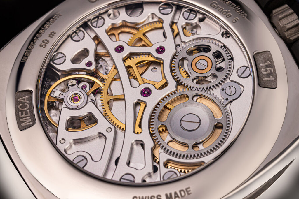 The rear of the MECA timepiece showing its movement