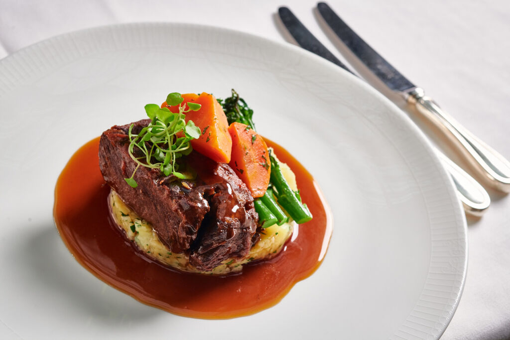 Slow-cooked short rib of beef, with crushed new potatoes, and tenderstem broccoli