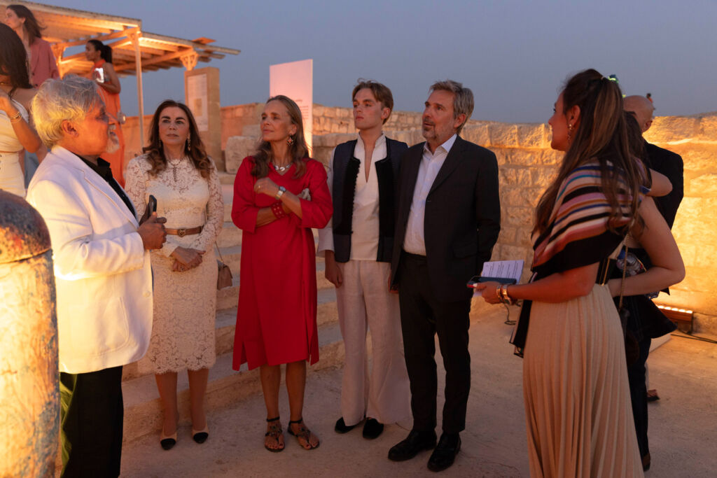 Some of the invited guests standing on the monuments walls