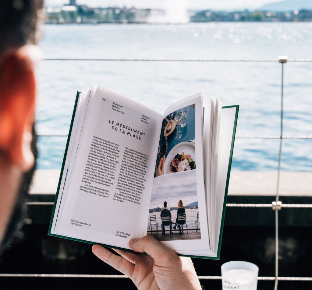 A man on a boat reading the guide