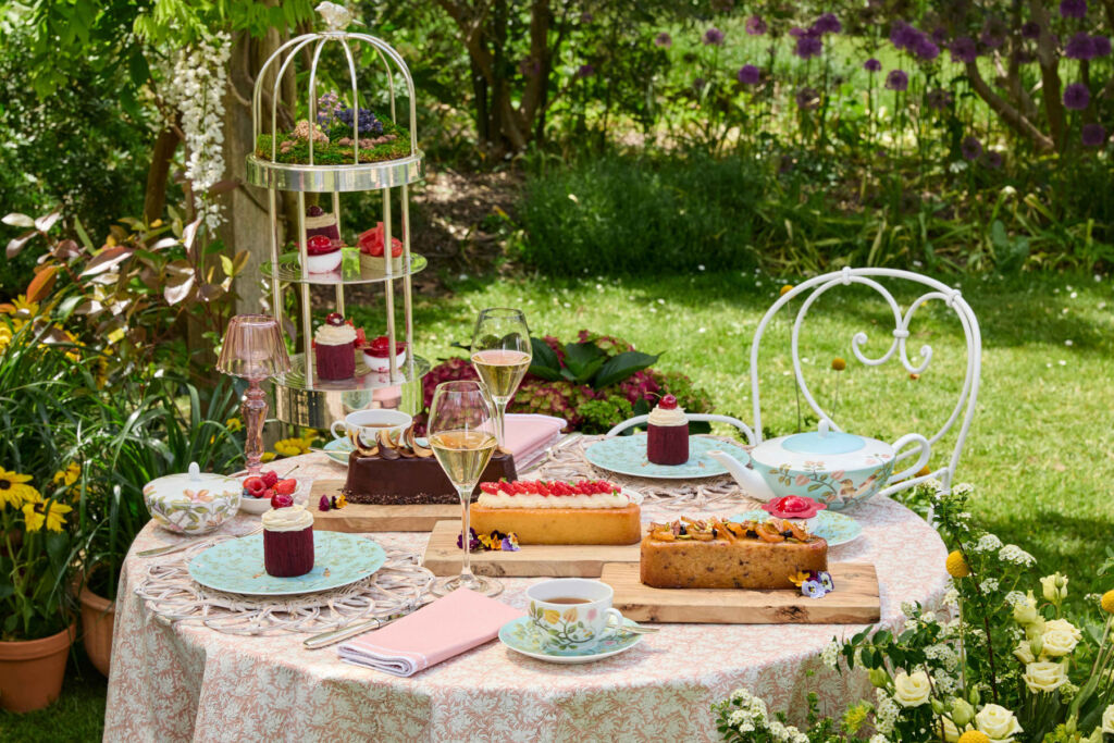 The afternoon tea laid out on a table in the garden