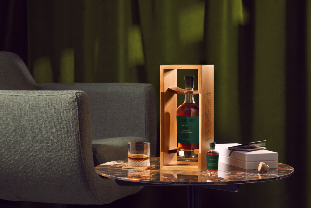 One of the bottles of whisky in its case on a table