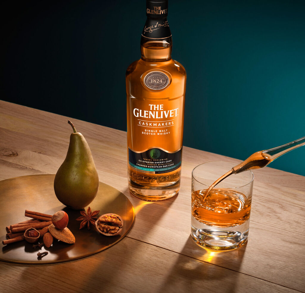 A bottle of The Glenlivet Caskmakers on a wood table