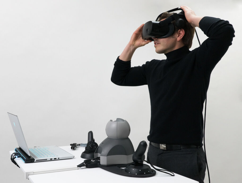 A man trying on the headset to learn about spinal surgery