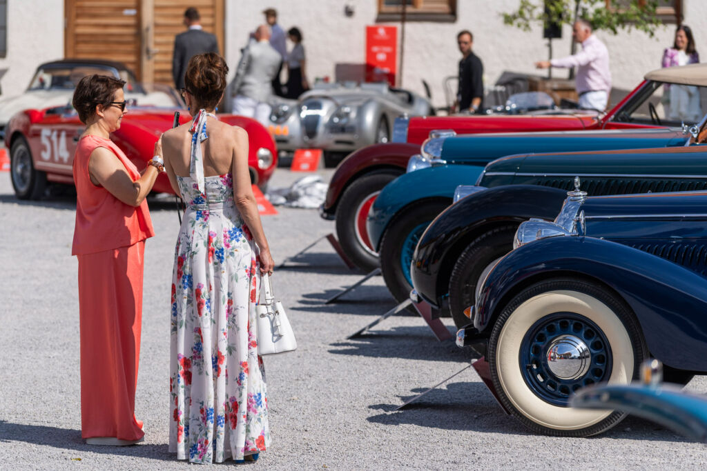 Two ladies admiring the cars