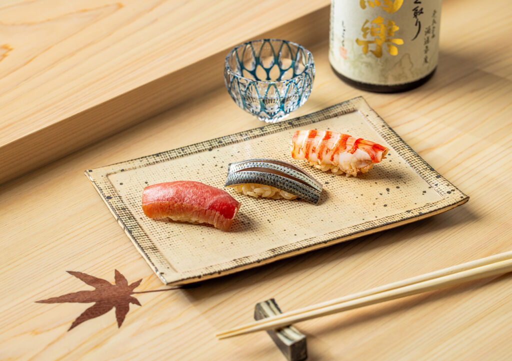 Three expertly prepared pieces of sushi ready to be enjoyed