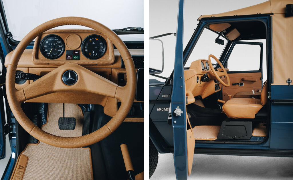 A photograph of the steering wheel and one of the passenger door open revealing the interior