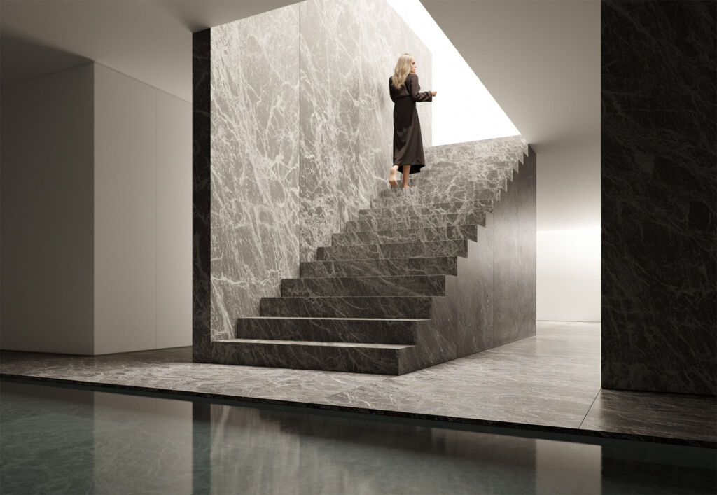 A woman walking up stairs inside the property