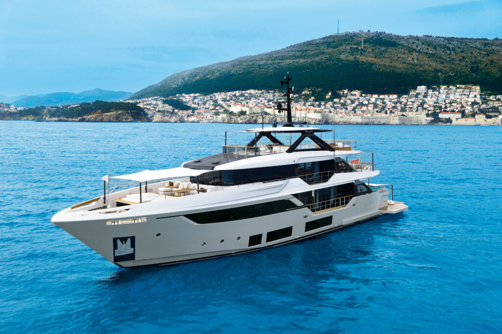 A three quarter angled view of the yacht on the water