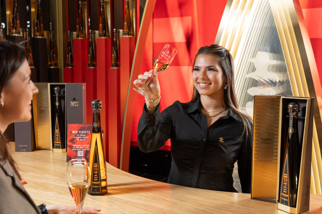 A female member of the pop-up team inspecting a glass