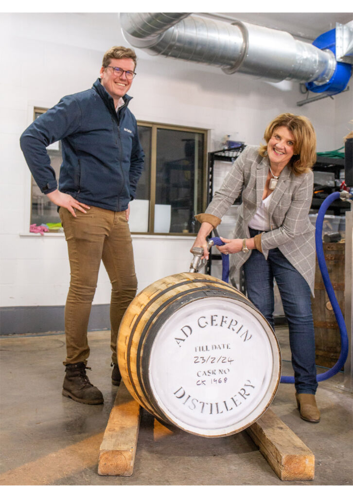 Ben and Eileen filling a cask