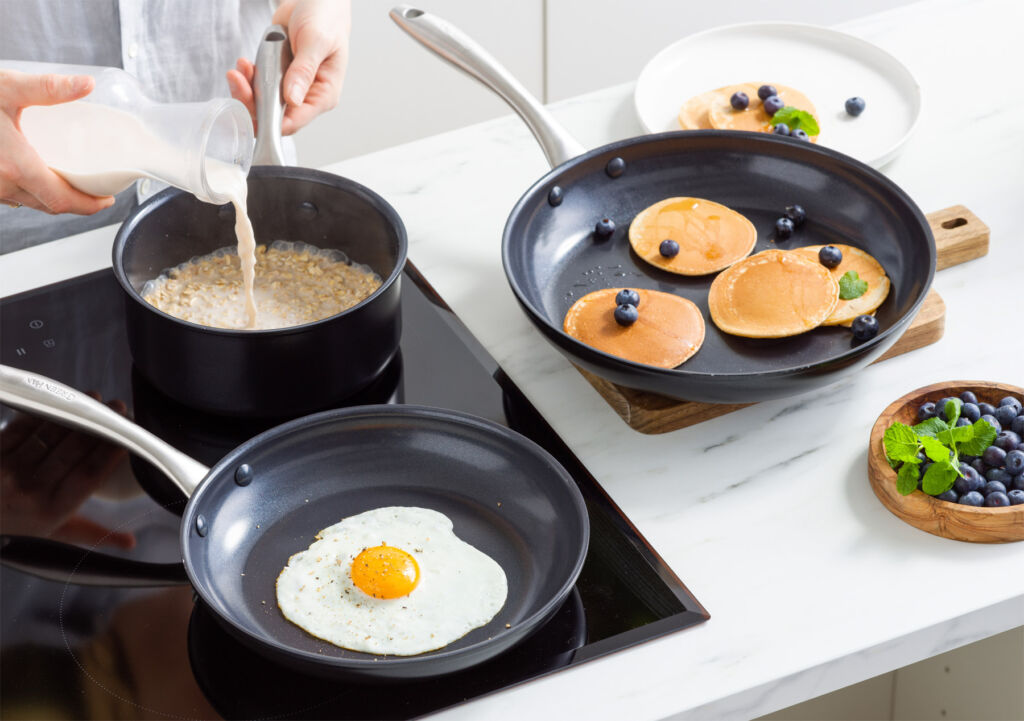 A man cooking breakfast on an induction hob