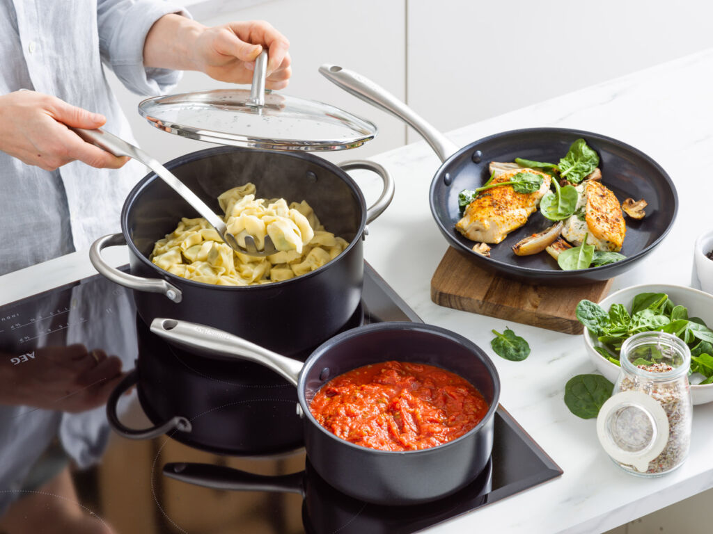 Pots from the collection being used on an induction hob