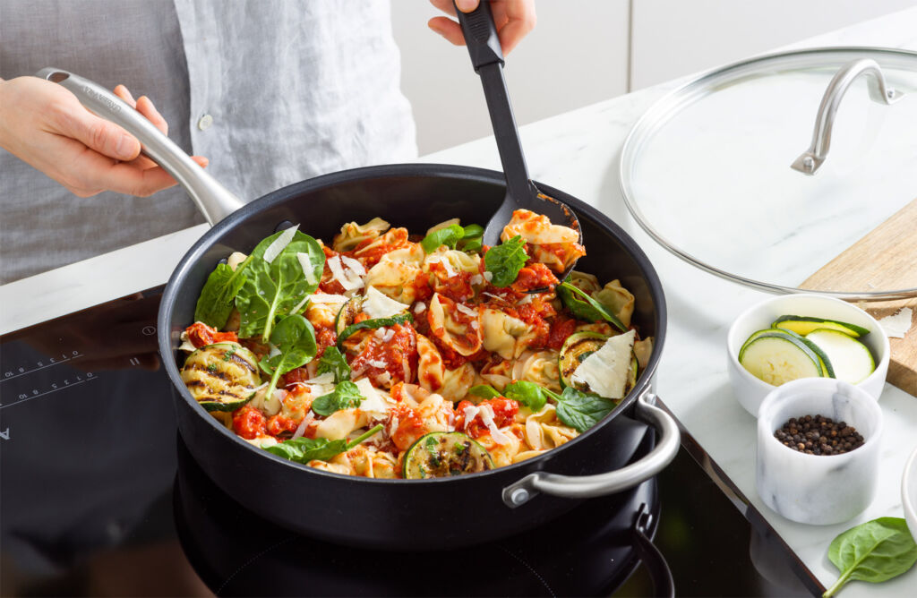 A close up view of a frying pan being used on an induction hob