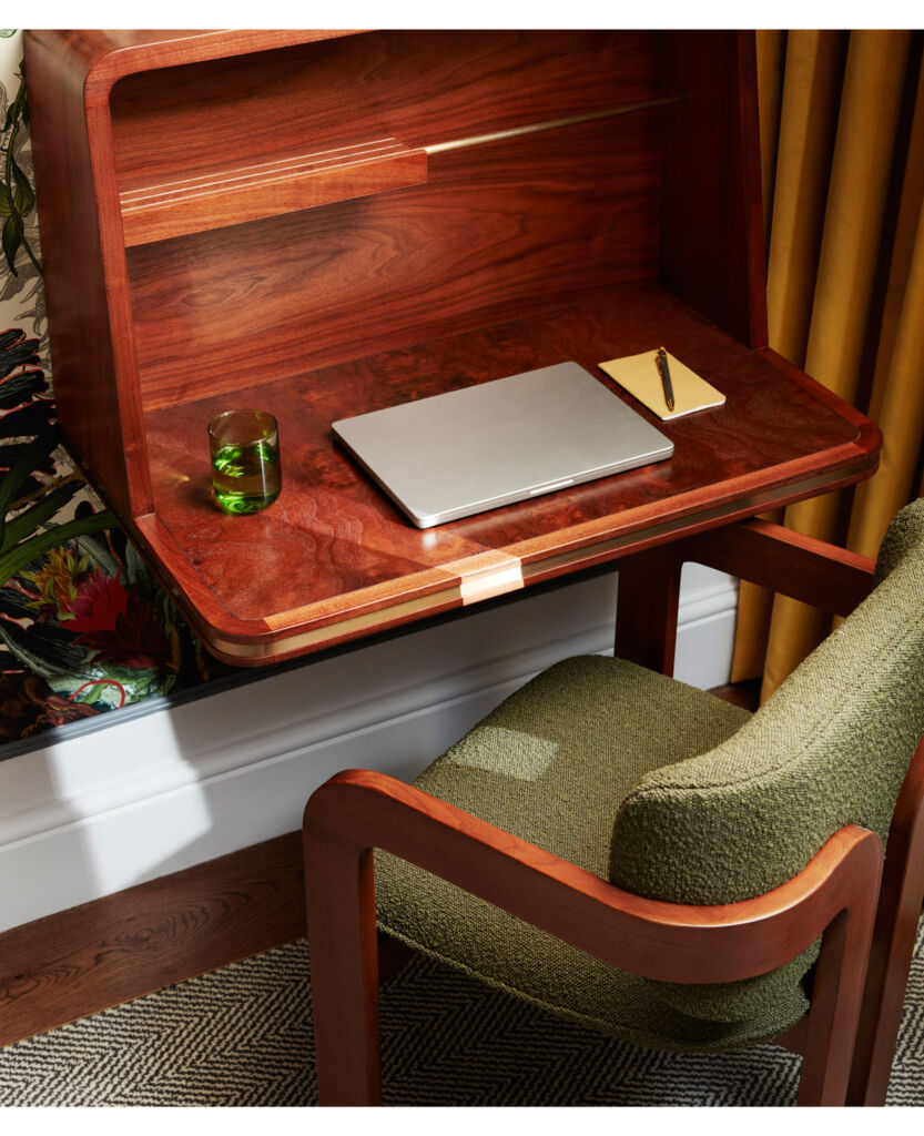 A fold down wooden desk in one of the rooms