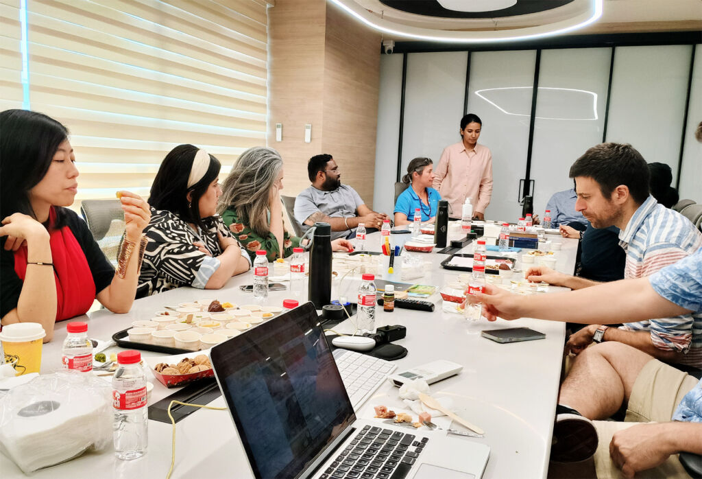 Corporate employees being taught the nuance of chocolate in an office