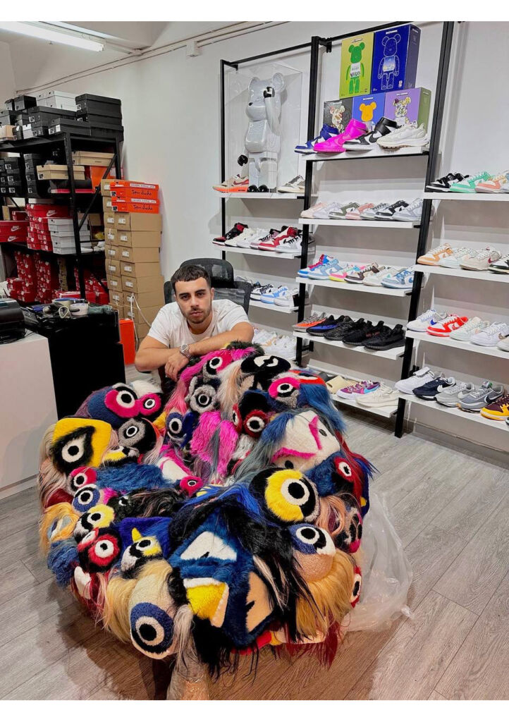 Solomon in his business premises with his collection or rare sneakers