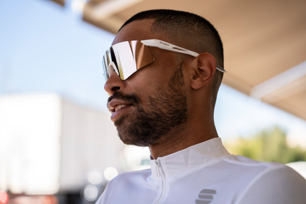 A man wearing a pair of the glasses with a white frame